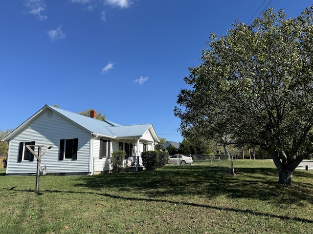 view of home's exterior featuring a yard