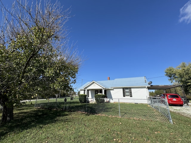 view of front facade with a carport and a front lawn