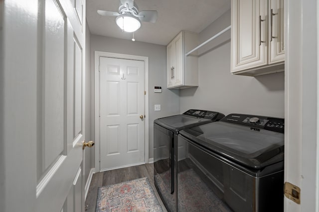 washroom featuring cabinets, independent washer and dryer, dark hardwood / wood-style flooring, and ceiling fan