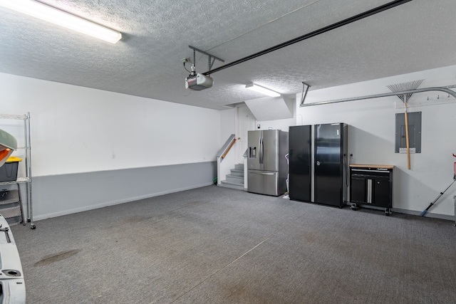 garage with black refrigerator, stainless steel fridge, electric panel, and a garage door opener