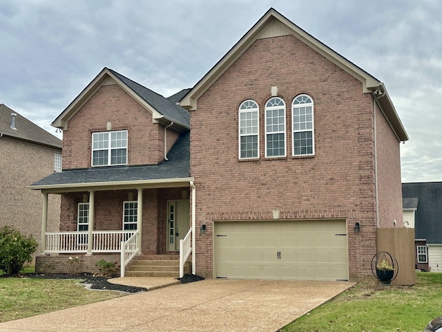 view of front of house featuring a porch and a garage