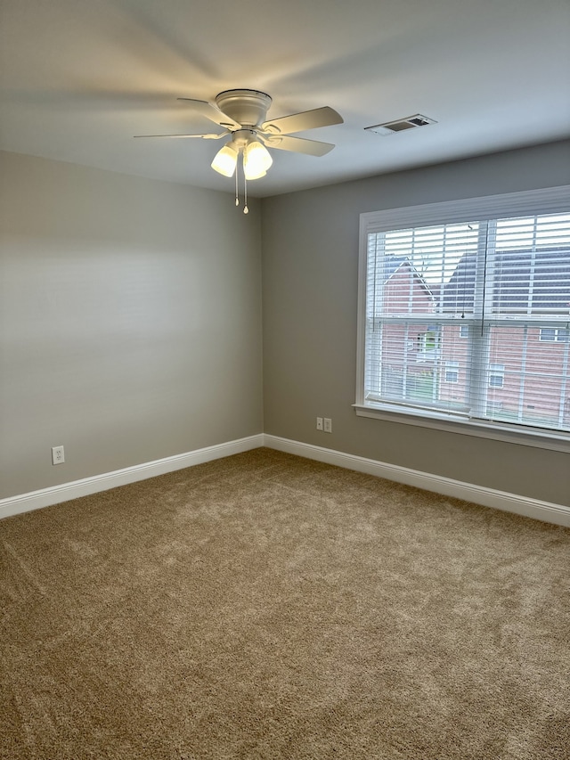 carpeted empty room with ceiling fan