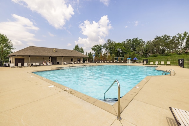 view of swimming pool with a patio area