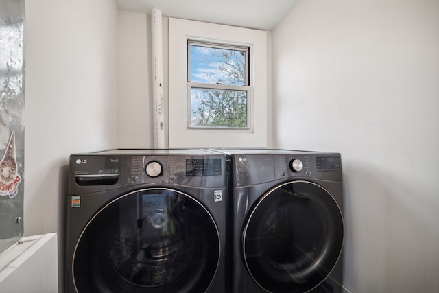 washroom with independent washer and dryer