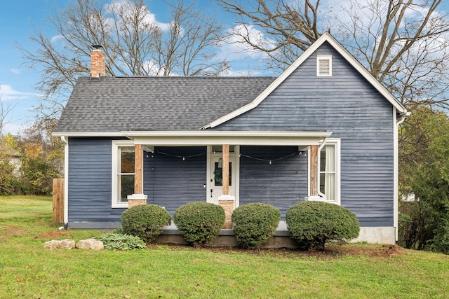 view of front of property with a porch and a front yard