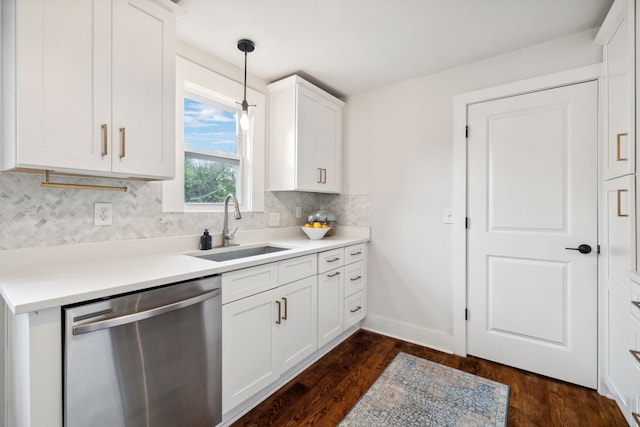 kitchen featuring stainless steel dishwasher, sink, decorative light fixtures, dark hardwood / wood-style floors, and white cabinetry