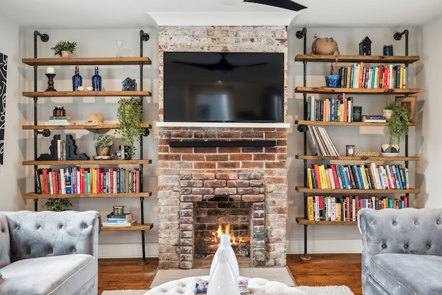 living area featuring a fireplace and hardwood / wood-style flooring