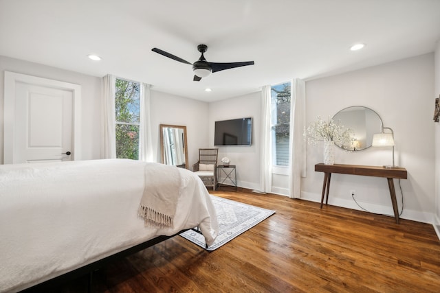 bedroom with hardwood / wood-style floors and ceiling fan