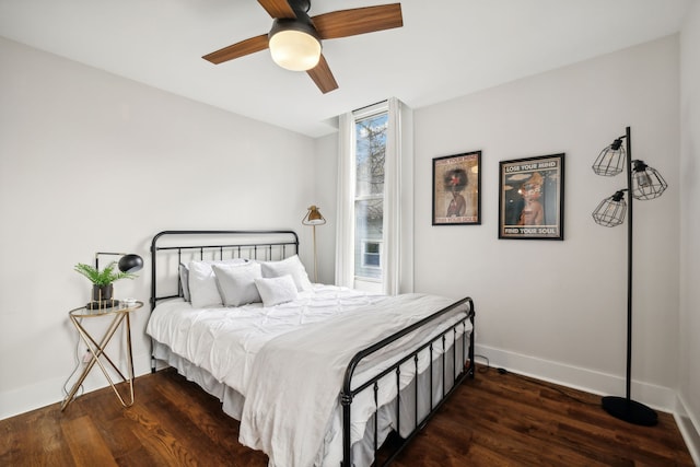 bedroom featuring ceiling fan and dark wood-type flooring