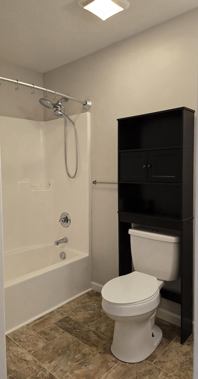 bathroom with shower / bathtub combination and toilet