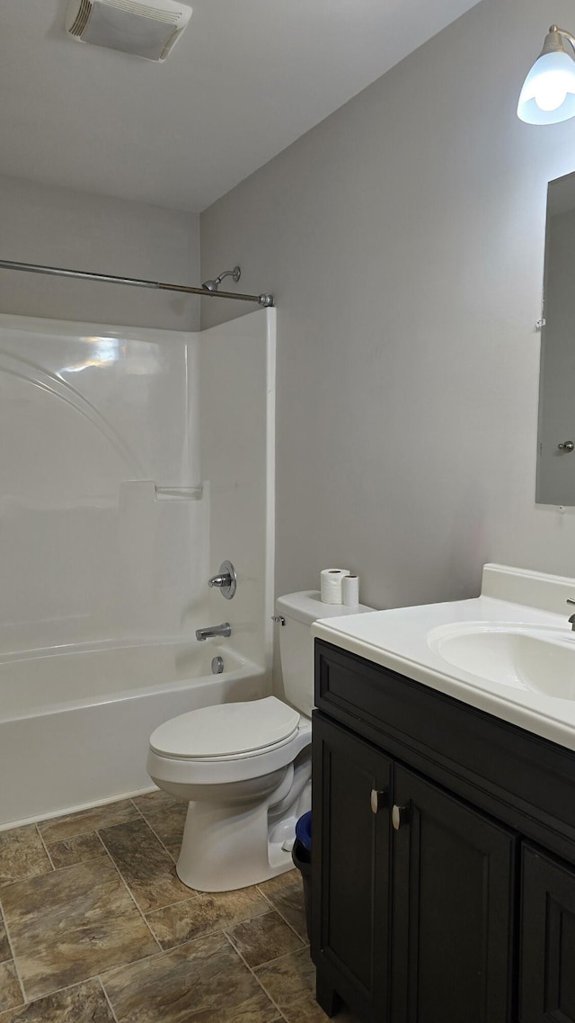 full bathroom with vanity, toilet, and shower / tub combination