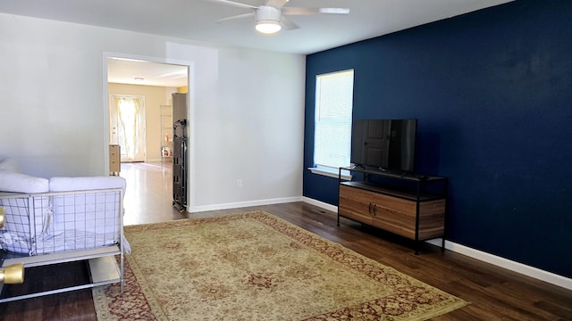 bedroom featuring ceiling fan and dark hardwood / wood-style floors