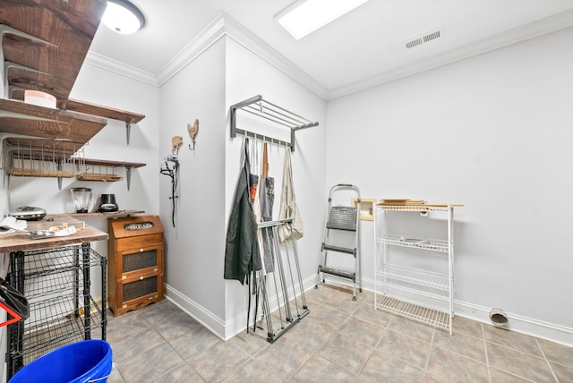 interior space featuring ornamental molding and light tile patterned flooring