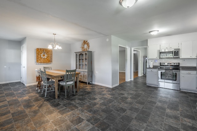 dining space with a notable chandelier