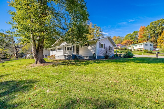 view of property exterior featuring a lawn