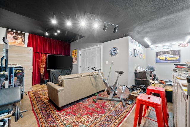 interior space featuring a textured ceiling and track lighting