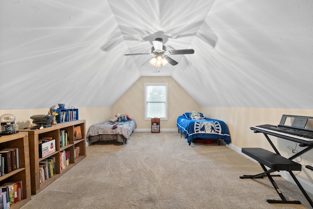 carpeted bedroom with ceiling fan and vaulted ceiling