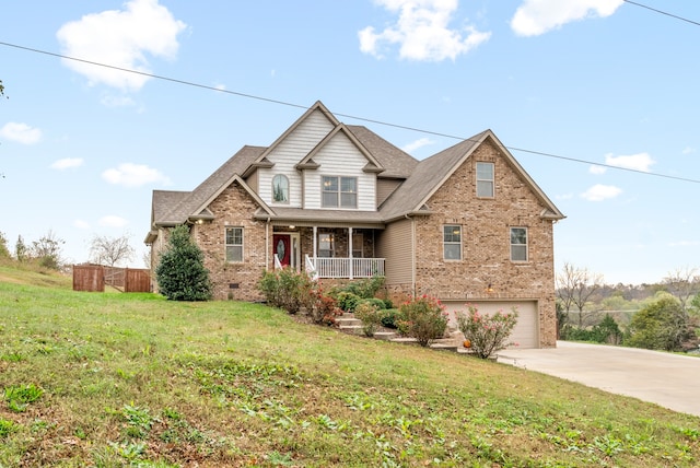 view of front facade featuring a front lawn, covered porch, and a garage