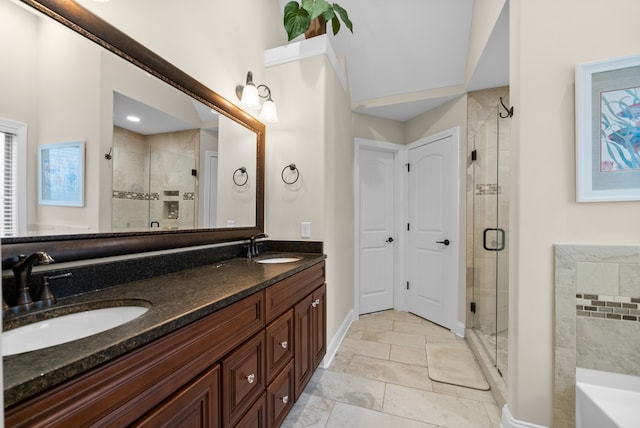 bathroom with vanity and a shower with door