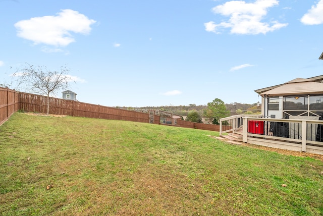 view of yard with a wooden deck