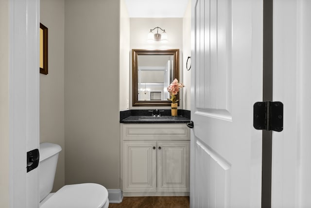 bathroom featuring vanity and toilet