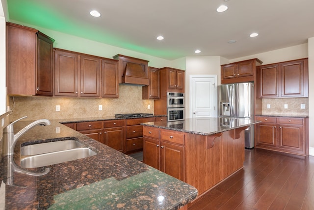 kitchen with premium range hood, dark hardwood / wood-style flooring, a kitchen island, and stainless steel appliances