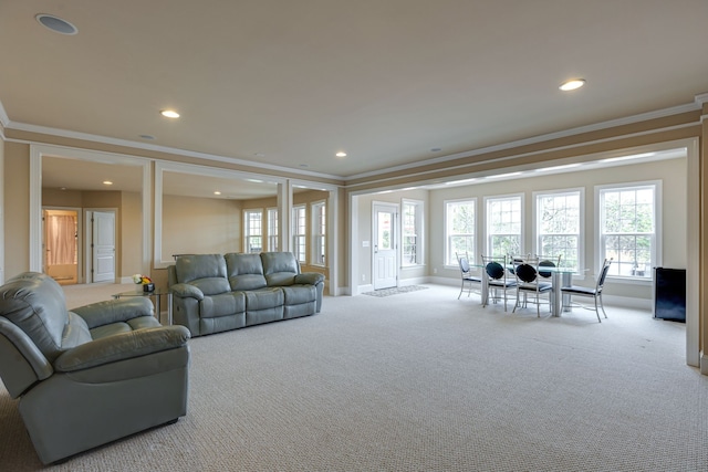 carpeted living room with ornamental molding