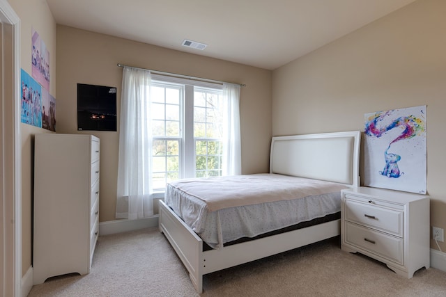 bedroom with light carpet