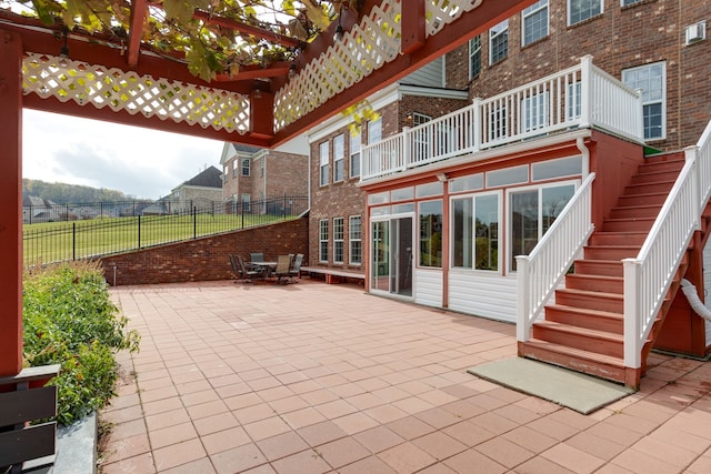 view of patio featuring a balcony