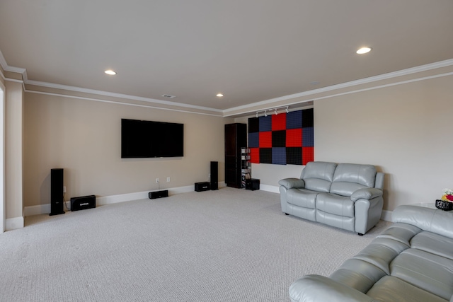 carpeted cinema room with crown molding