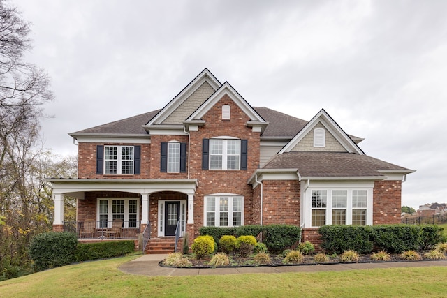 view of front facade featuring a porch and a front yard