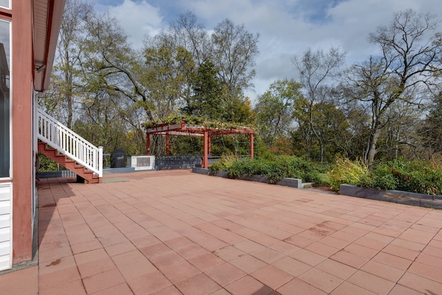 view of patio featuring a pergola