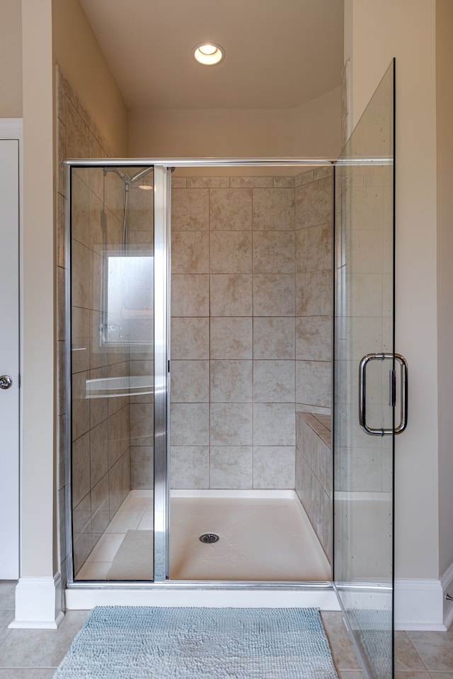 bathroom featuring tile patterned flooring and walk in shower