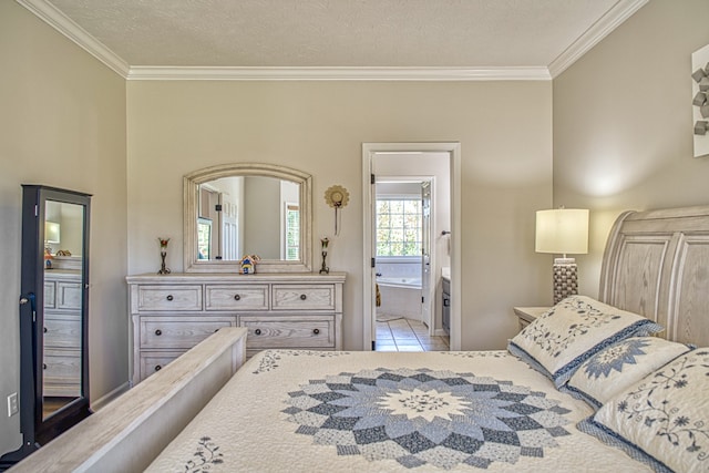 bedroom with ensuite bath, light tile patterned floors, a textured ceiling, and ornamental molding