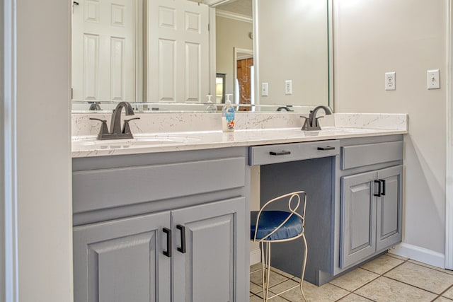 bathroom featuring vanity, tile patterned floors, and crown molding