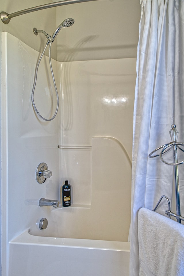 bathroom featuring shower / bath combination with curtain