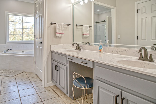 bathroom with tile patterned floors, vanity, ornamental molding, and shower with separate bathtub