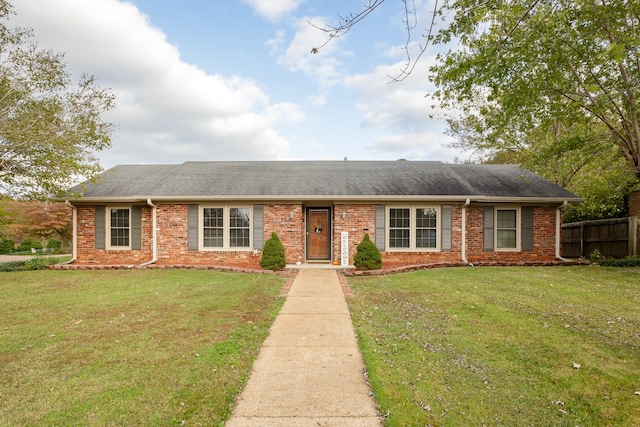 single story home with a front yard