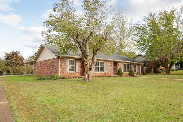 ranch-style house with a front lawn