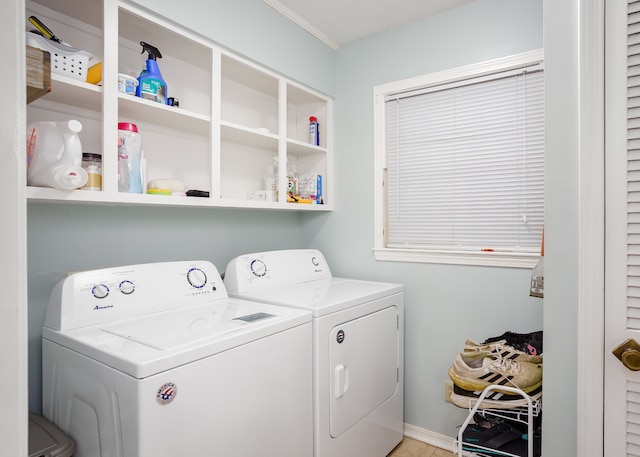 clothes washing area featuring washer and clothes dryer