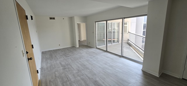 spare room featuring hardwood / wood-style flooring