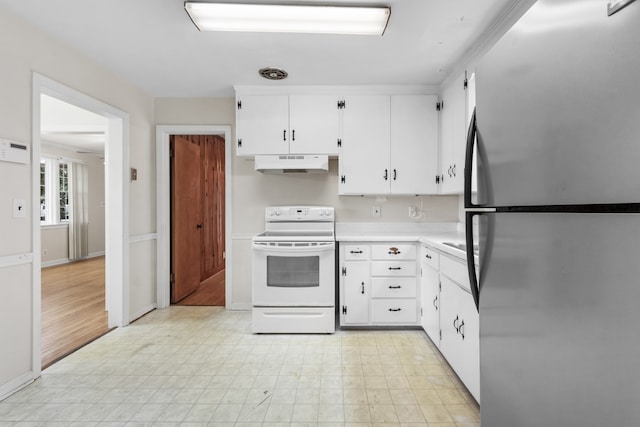 kitchen featuring white range with electric cooktop, white cabinetry, stainless steel refrigerator, and light hardwood / wood-style flooring