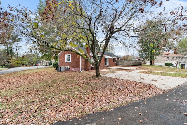 view of home's exterior with central AC