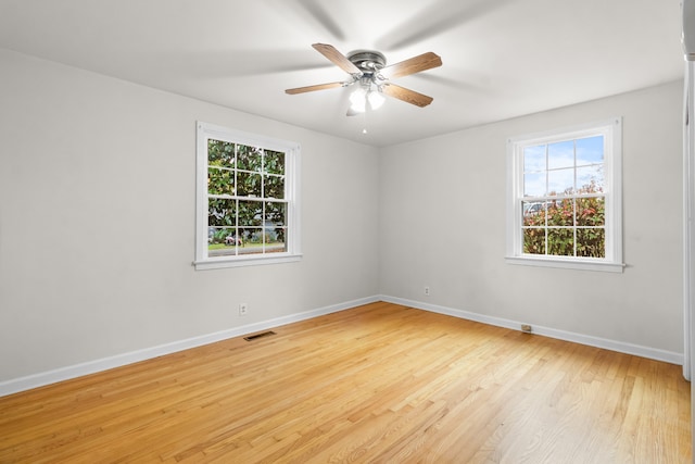 unfurnished room featuring ceiling fan and light wood-type flooring