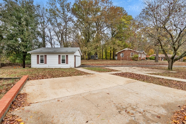 exterior space with an outdoor structure and a garage