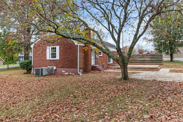 view of side of home featuring central air condition unit