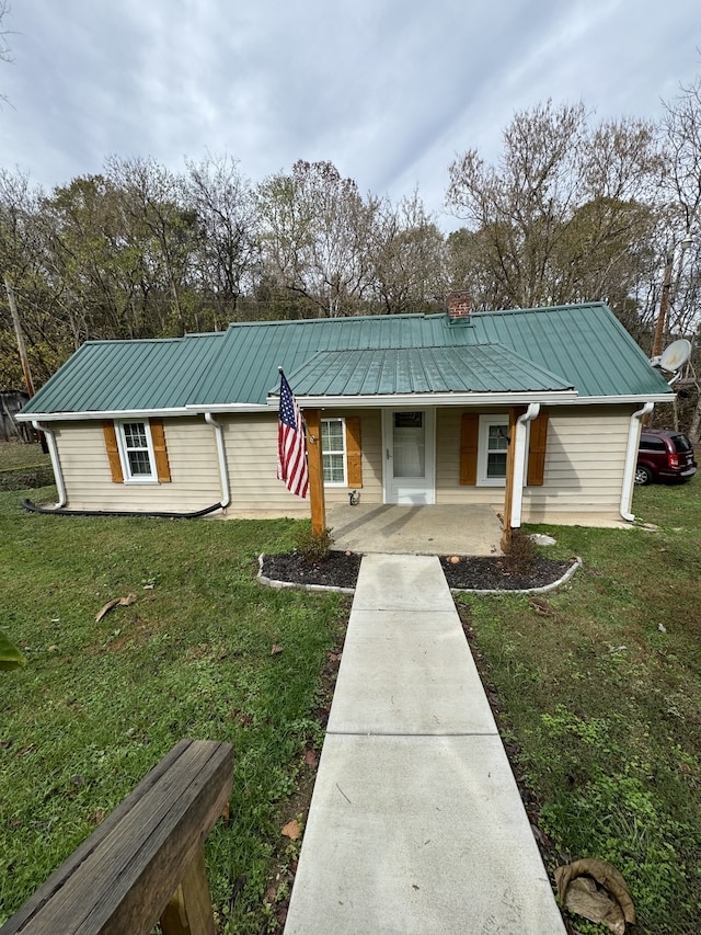 ranch-style home featuring a front yard and a porch