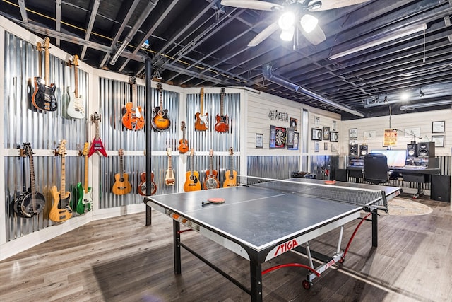 playroom with ceiling fan and wood-type flooring