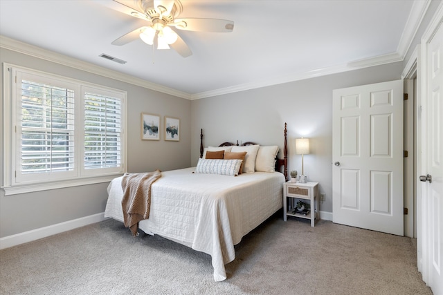 carpeted bedroom with ceiling fan and crown molding