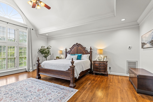 bedroom with ceiling fan, crown molding, dark wood-type flooring, and multiple windows